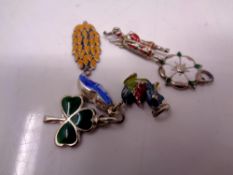 A collection of silver charms