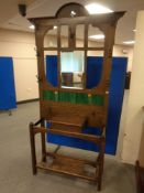 A 19th century oak mirrored tiled hall stand
