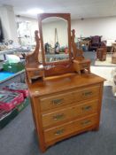 An Edwardian three drawer dressing chest