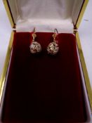 A pair of 9ct gold diamond drop earrings