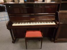 A mahogany cased overstrung piano by Kemble of London together with storage piano stool