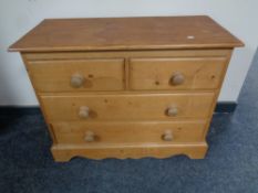 A pine chest of four drawers