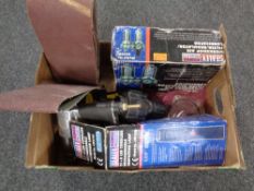 A box containing a quantity of compressor attachments, inspection lamp,