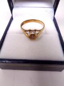 A 9ct gold dress ring set with a small diamond