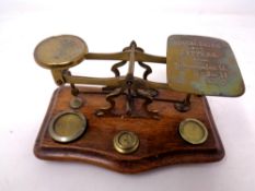 A set of antique postal scales with weights