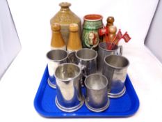 A tray of stoneware bottles,