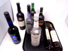 A tray of eight bottles of alcohol including Bristol Cream, Pimms,