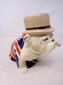 A Royal Doulton British Bulldog smoking a cigar, height 12 cm.
