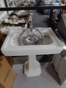 A Berkeley ceramic pedestal sink and shower fitting