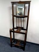 An oak mirror backed hall stand