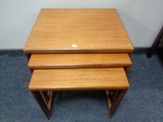 A teak nest of three tables