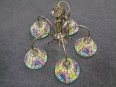 A contemporary five branch light fitting