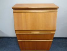 A 20th century teak fall front bureau
