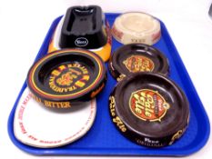 A tray of money bank, ash trays bearing advertising,