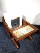 A child's chair together with a painted wall cabinet
