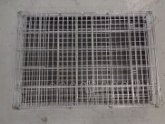 Two folding metal pet cages