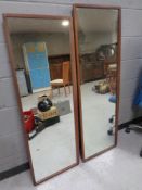 Two teak framed wall mirrors