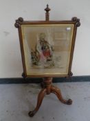 A Victorian rosewood tapestry pole screen