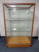 A sliding door shop display cabinet fitted two internal shelves,