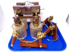 A tray of three teak wall lights together with a further pair of wall lights with glass shades