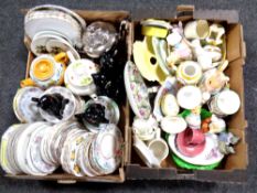 Two boxes of 20th century teapots, saucers, cat tea pots,