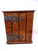 An oak single door wall cabinet