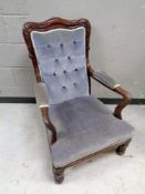 A Victorian armchair in lilac buttoned fabric