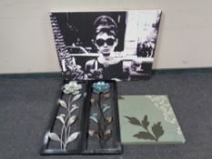 A group of contemporary wall canvases and metal wall art