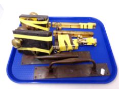 A tray of brass door furniture