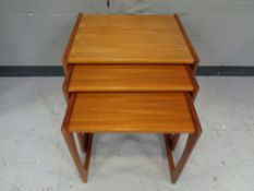 A teak nest of three tables