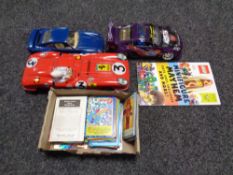 A tray of tin plated Ferrari, basketball cards, Yu-gi-oh,