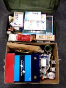 A box and suitcase containing ornaments,