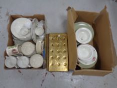 Two boxes of 20th century dinner wares and two brass beer drip trays