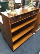 A yewwood open bookcase