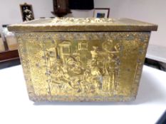 An early 20th century brass embossed coal box.