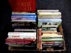 Two boxes of books relating to military vehicles and warfare