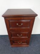 A Victorian style three drawer chest with brass drop handles