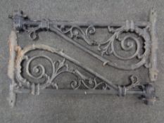 A pair of antique cast iron wall lantern brackets