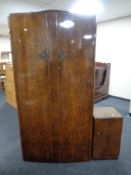 A 1930's walnut double door wardrobe together with bedside cabinet and 4'6