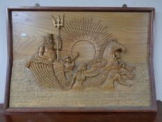 A carved wooden relief panel 
