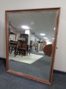 An overmantel mirror 130cm by 100cm.