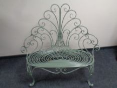 A wrought iron Art Deco style garden bench 118cm wide by 65cm deep by 115cm high.