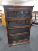 An Edwardian oak four-tier stacking bookcase