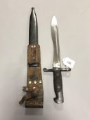 A Spanish Bolo bayonet in metal scabbard with leather frog