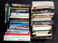 Two boxes of books relating to military vehicles and warfare