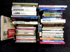 Two boxes of books relating to military vehicles and warfare