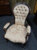 A 19th century mahogany framed spoon back armchair