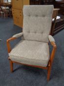 A 20th Cintique century teak framed armchair