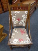 An Edwardian beech nursing chair