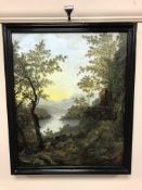 An oil on canvas depicting a lake with mountains beyond, 39 cm x 48 cm, framed.